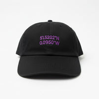 Load image into Gallery viewer, Black cap with purple embroidered coordinates on a neutral background
