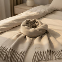 Load image into Gallery viewer, Beige scarf with fringe on a bed
