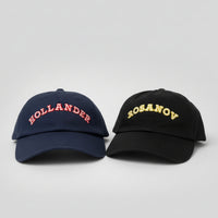 Load image into Gallery viewer, A navy blue and black baseball cap with text in a studio shot
