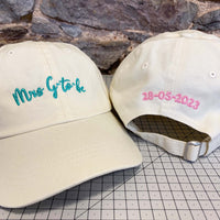 Load image into Gallery viewer, two beige caps with Mrs G to Be embroidered on the front, and a date embroidered on the back.
