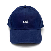 Navy cap with the word Dad embroidered in white thread. 