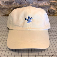 Load image into Gallery viewer, beige canvas cap with an embroidered vintage bluebird motif on the front.
